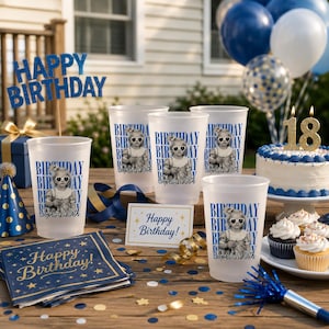 May include: A birthday party scene with blue and gold decorations. Includes frosted plastic cups with a photo and text, a cake with an "18" candle, and a "Happy Birthday" sign. Balloons and confetti complete the festive look.