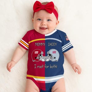 May include: A baby bodysuit featuring a split design with a red left side and a blue right side. The text reads Mommy, Daddy, and I root for both! with two football helmet graphics. A small American flag patch is on the sleeve and a red bow headband.