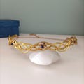 Medieval crown inspired by Éowyn. Delicate Celtic-style headband. Braided gold wire crown with blue stones. Cosplay jewelry. product logo