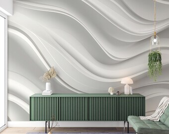May include: A green media console with a white wavy abstract design on the wall behind it. A hanging plant and a lamp are on the wall. A gray rug is on the floor in front of the console.