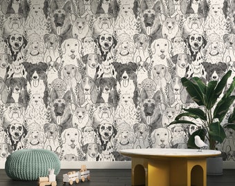 May include: A black and white wallpaper featuring a repeating pattern of various dog breeds. The wallpaper is displayed in a room with a light grey ottoman, a wooden toy train, and a yellow table with a white top.