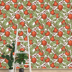 May include: A white background with a repeating pattern of red apples and green leaves. A white ladder is in the foreground with two potted plants.