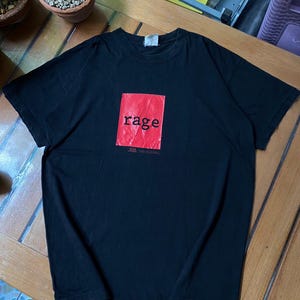 Vintage Rage Against The Machine Guerilla Radio T-shirt , Artimonde Tag , Rage Against T shirt , Rage Against Band tee , Vtg Rock Band tee