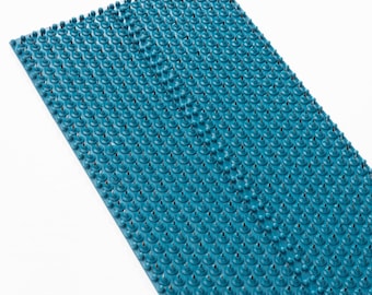 May include: A blue acupressure mat with a grid of small, rounded spikes. The mat is designed to stimulate pressure points on the feet and body.