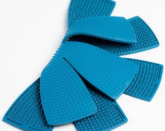 May include: A set of six blue, textured, semi-circular hair styling tools. The tools have a raised, bumpy surface and are designed to be used on wet hair.