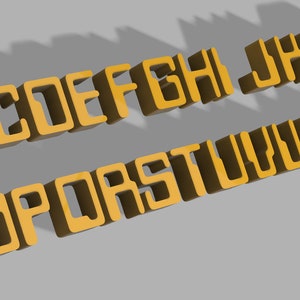 May include: A 3D alphabet in a gold colour with a blocky, retro style font. The letters are arranged in two rows, with the first row being A through I and the second row being J through Z.