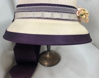 Vintage Bonnet Cream colored with a deep purple ribbon.