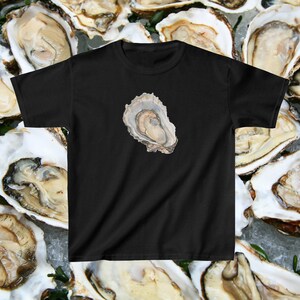 May include: A black t-shirt featuring a single oyster printed on the front. The oyster is open, revealing the inside of the shell.