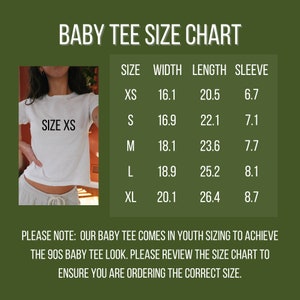 May include: A size chart for baby tees, showing the width, length, and sleeve length in inches for sizes XS, S, M, L, and XL. The chart is on a green background. The text "SIZE XS" is visible on a white baby tee worn by a model.