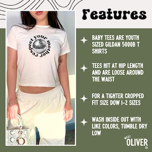 Puede incluir: Una camiseta blanca de manga corta con un gr&aacute;fico circular negro de una bola de discoteca con el texto "respect your mother". El texto a la derecha enumera caracter&iacute;sticas: "baby tees are youth sized gildan 5000b t shirts", "tees hit at hip length and are loose around the waist", "for a tighter cropped fit size down 1-2 sizes" y "wash inside out with like colors, tumble dry low".
