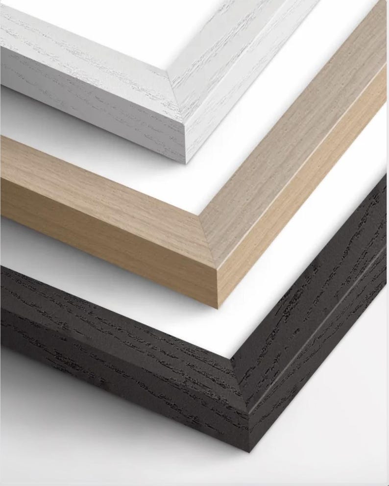 The three types of frames that we offer: white, wood, and black. The frames are available in two materials: ash and oak wood.