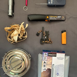 May include: A camping and survival kit with a variety of items, including a flashlight, a knife, a fire starter, a water purifier, a water tank, and a radio.