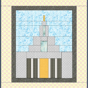 May include: A quilt block with a geometric design featuring a gray, white, and yellow building with a blue sky background. The building is made up of squares and rectangles, and the sky is a light blue with a white marbled pattern.