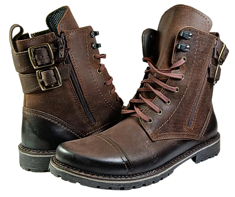 Detailed close-up of fine stitching and natural leather grain on handcrafted men’s ankle boots made in Poland.
