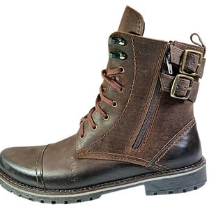 Detail of laced front and side zipper on casual chukka-style combat boots, combining fashion with function