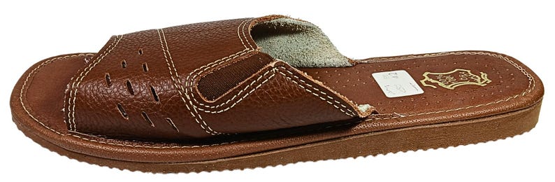 Close-up of soft sheepskin-cushioned footbed showing plush texture and comfort detail inside the leather sandals
