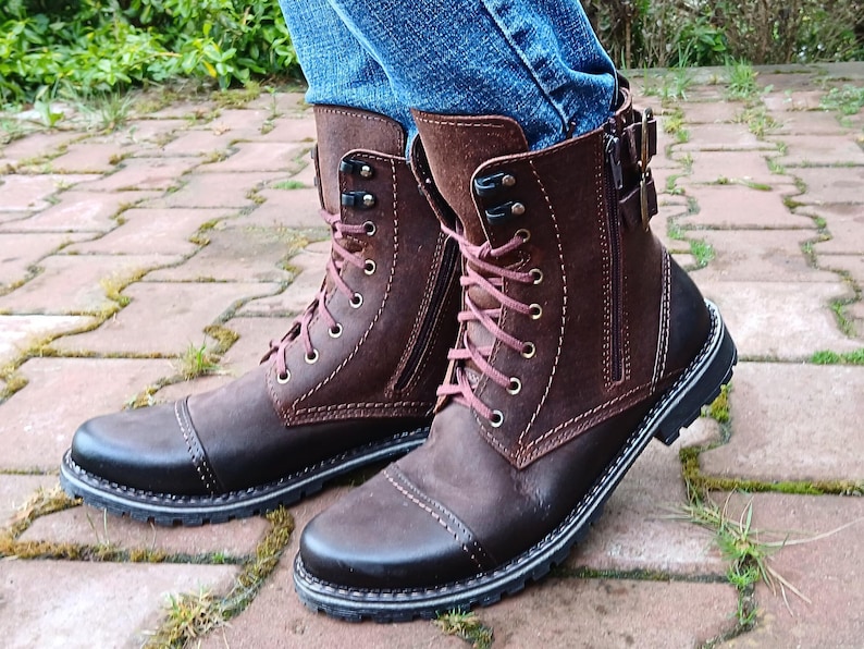Profile view of men’s motorcycle-style leather boots with a functional side zipper, ankle height design, and durable stitching details.