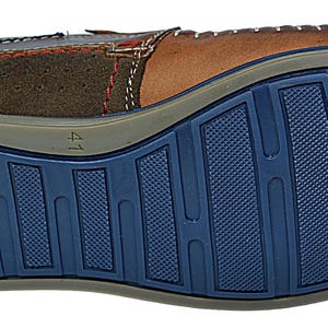 Flexible EVA rubber sole on men’s moccasins, ensuring a firm grip and superior walking comfort.