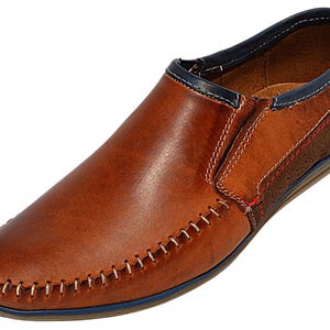 Close-up of premium genuine leather loafers, showcasing hand-stitched moccasin detailing.