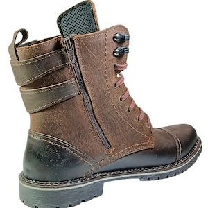 Rear view of men’s ankle combat boots showing sturdy heel support, reinforced stitching, and premium leather texture.