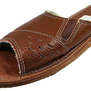 Comfortable leather house shoes with soft lining and durable construction.