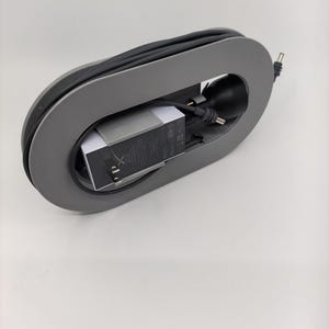Starlink cable management spool organizer with adapter mounts for chargers.