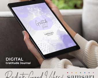 May include: A digital gratitude journal with a purple watercolour background and floral design. The text "Gratitude Journal" is written in white with a purple outline. The text "samsari curated crystals" is written in white with a rainbow dot pattern.
