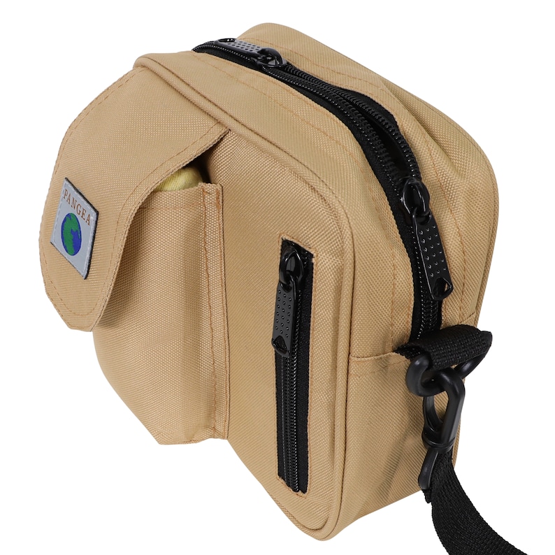 May include: A tan canvas crossbody bag with black zips and a black strap. The bag has a large front pocket with the word "PANGEA" and a globe logo.