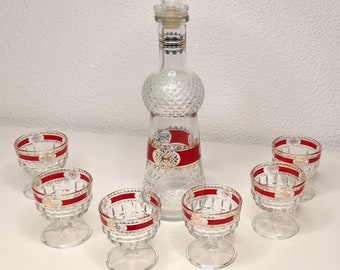 Vintage shot glass carafe set from the 1970s, with red and gold color application