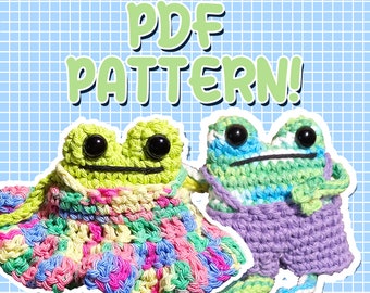 May include: Two crocheted frog plushies, one wearing a colorful dress and the other wearing purple overalls. The text "PDF PATTERN!" is written above the frogs.