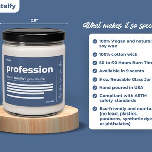 May include: A white candle jar with a black lid and a blue label that reads "profession" with the name "Jennifer" and its pronunciation. The candle is on a wooden base. The text on the right side of the image lists the candle's features, including that it is made with 100% vegan and natural soy wax, has a 100% cotton wick, and burns for 50 to 60 hours.