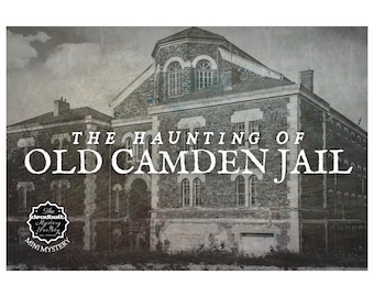 May include: A black and white photo of an old, brick building with the text "The Haunting of Old Camden Jail" superimposed on the image. The image is labeled "The Deadbolt Mystery Party Mini Mystery".