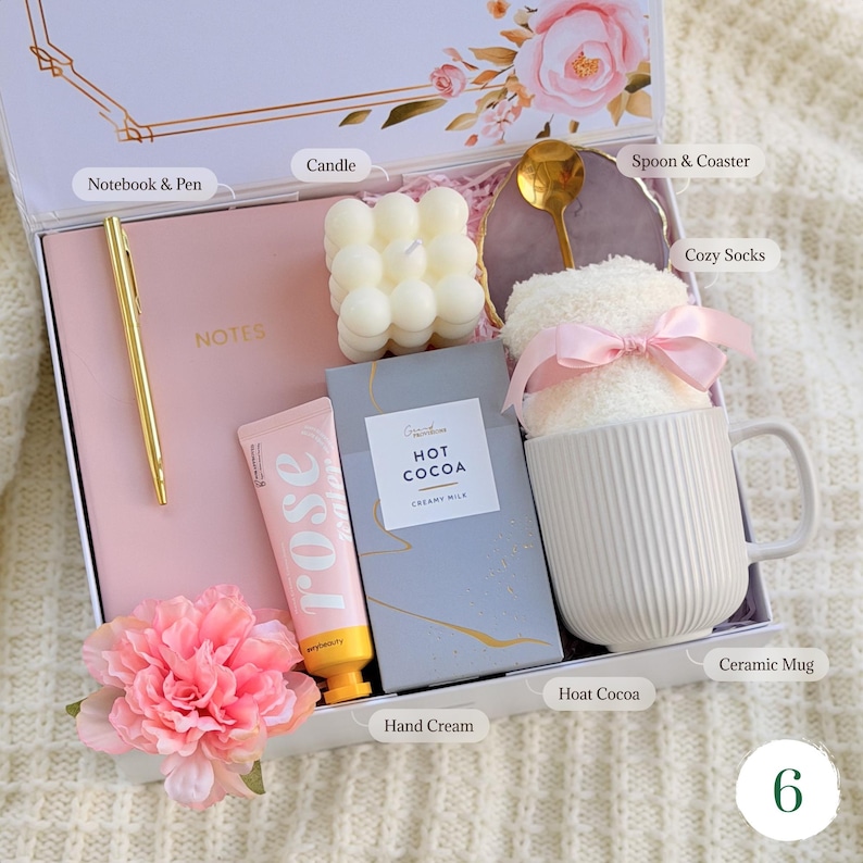 Hygge gift basket for her with notebook, pen, candle, ceramic mug with 
hot cocoa, dried flowers, and chocolate — thoughtful birthday gift
