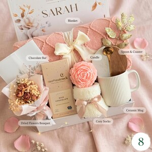 Personalized gift basket with custom name card, peach dried flower 
bouquet, chocolate bar, gourmet cookies, ceramic mug — birthday gift for her