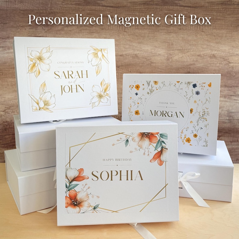 May include: Four white gift boxes with magnetic closures. Each box features a different floral design and personalized text. The top box says "Congratulations Sarah and John". The second box says "Thank you Morgan". The third box says "Happy Birthday Sophia".