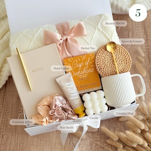 Cute gift set for women with notebook, pen, hair accessories, candle, 
ceramic mug, and dried flowers — thoughtful gift box for her
