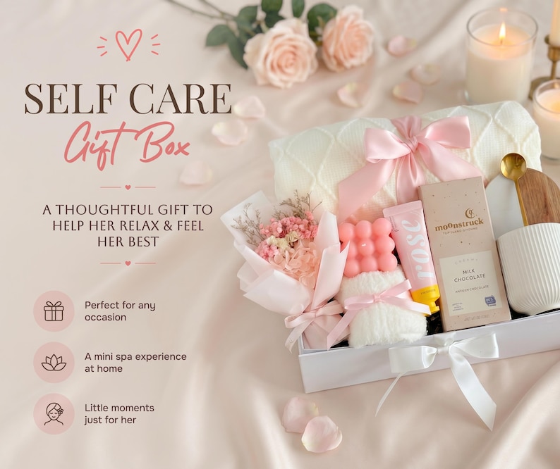 May include: A self-care gift box containing a selection of items such as a pink bow, a bouquet of flowers, a bar of chocolate, and a tube of rose-scented lotion. The box is tied with a white ribbon and includes a white towel and a pink soap.