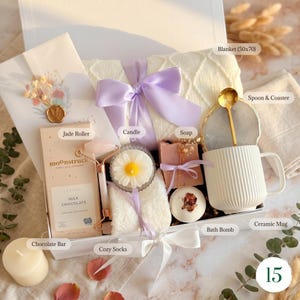 Luxury lavender gift basket with cozy blanket, dried flower bouquet, 
chocolate, gold spoon, and hand cream — premium spa gift box for her