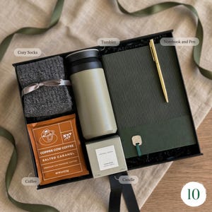 Cozy mens gift box with knit socks, sage green insulated tumbler, sandalwood candle, Vietnamese salted caramel coffee and notebook with gold pen — birthday gift for brother