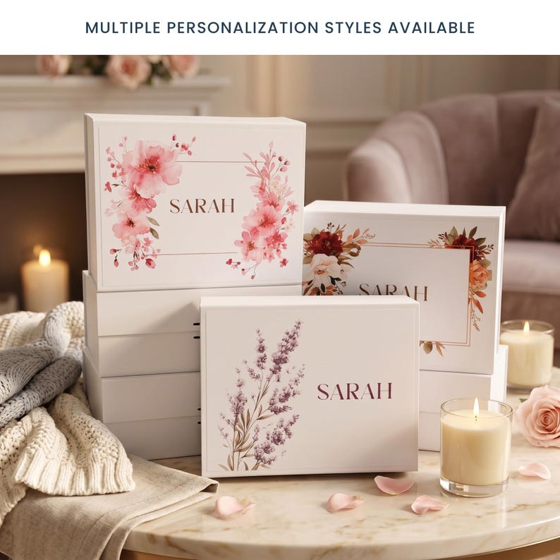 May include: White gift boxes with floral designs and the name "SARAH" printed on them. The boxes feature various floral arrangements in shades of pink, red, and purple. The text "MULTIPLE PERSONALIZATION STYLES AVAILABLE" is at the top.