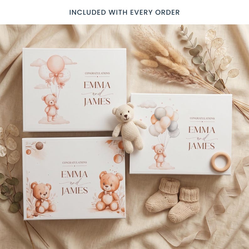 May include: Three white gift boxes with teddy bear illustrations and the text "CONGRATULATIONS EMMA and JAMES". A small teddy bear, a wooden ring, and a pair of knitted baby booties are also present. The boxes feature watercolor-style illustrations of teddy bears and balloons.