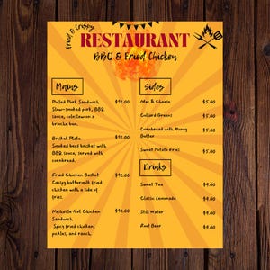 May include: A yellow and orange restaurant menu with a sunburst pattern. The menu lists BBQ and fried chicken dishes, including pulled pork sandwich, brisket plate, fried chicken basket, and Nashville hot chicken sandwich. Sides include mac and cheese, collard greens, cornbread with honey butter, and sweet potato fries. Drinks include sweet tea, classic lemonade, still water, and root beer.