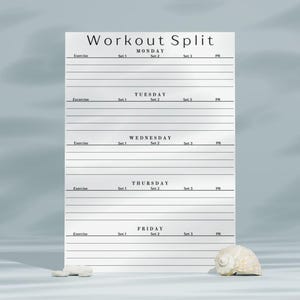 May include: A white workout split planner sheet with black text and horizontal lines. The document features sections for Monday through Friday, with columns for Exercise, Set 1, Set 2, Set 3, and PR. A small white seashell sits at the bottom right corner.