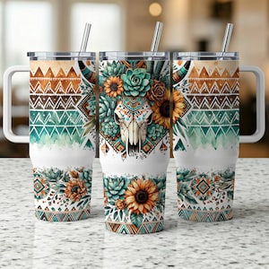 May include: Three stainless steel tumblers with lids and straws. The tumblers feature a white background with a colorful design of a skull with flowers and geometric patterns. The design is in shades of teal, brown, and orange.