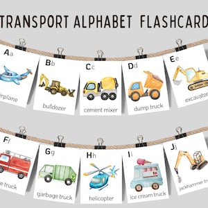 May include: A collection of transport alphabet flashcards suspended from a rope. Each card displays a watercolour illustration of a vehicle, including an airplane, bulldozer, and fire truck, alongside the relevant letter and name. The text "TRANSPORT ALPHABET FLASHCARDS" is at the top.