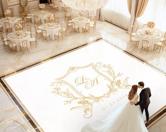 May include: A white dance floor with a gold monogram and the date 07.23.2024. A bride and groom are standing on the dance floor.