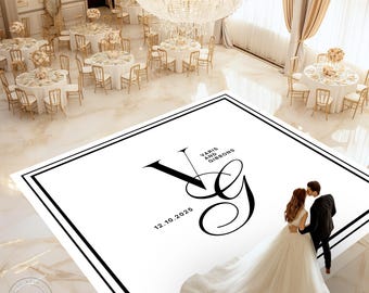 May include: A wedding reception scene with round tables set for guests. A large white floor graphic features the initials "VG", the date 12.10.2025, and the names "Varis and Gibbons". A couple is kissing on the graphic.