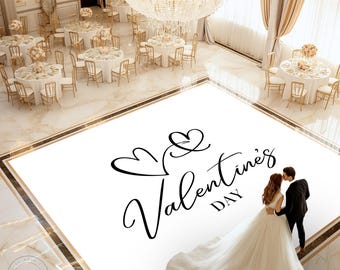 May include: A white dance floor with a black graphic of two hearts and the text "Valentine's Day". A bride and groom are standing on the dance floor.