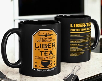 Liber-Tea Helldivers 2 Taza Taza de la mañana de Liber-Tea / Taza negra (11 oz, 15 oz)