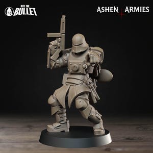 May include: A gray miniature figurine of a soldier in full armor, holding a rifle and pointing. The figurine is on a black base. The text "Bite the Bullet" and "Ashen Armies" are visible.